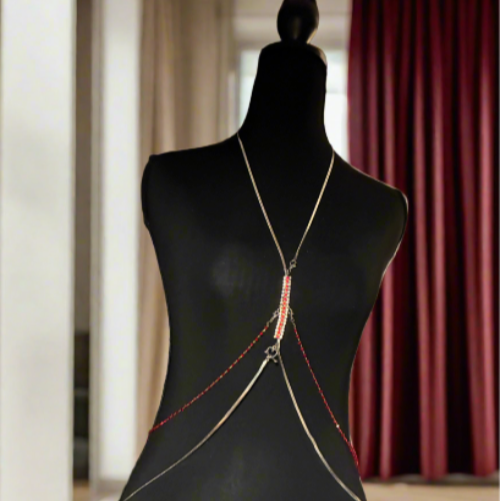 Mannequin wearing a decorative necklace with a blurred indoor background